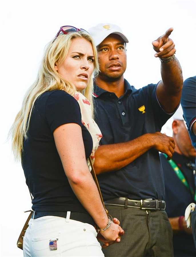 Tiger Woods compite en el Presidents Cup, acompañado de su novia