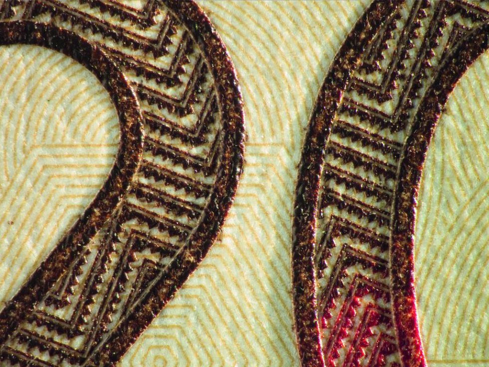 En colores naranja y café aparece con textura de caña flecha el valor del billete. En colores naranja y café aparece con textura de caña flecha el valor del billete.